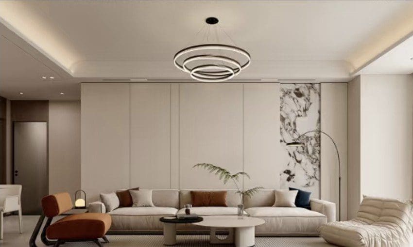 Modern living room with circular chandelier and neutral decor.