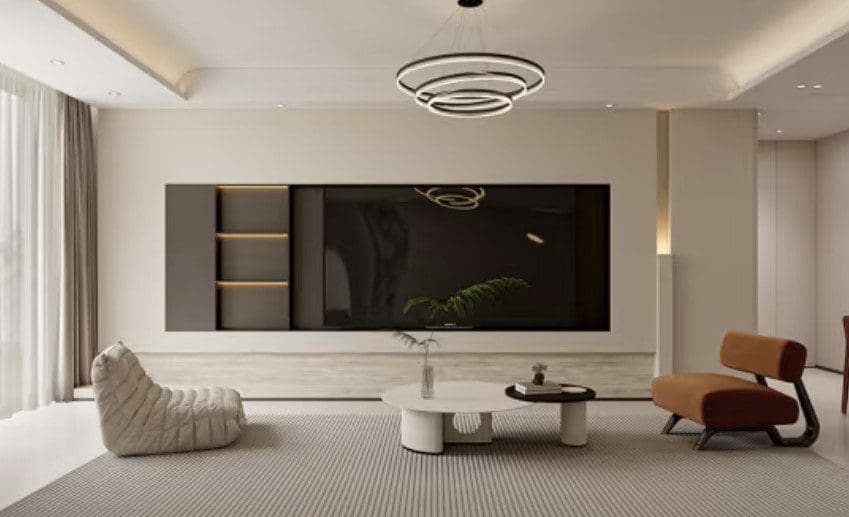 Modern living room with sleek TV and minimalist furniture.