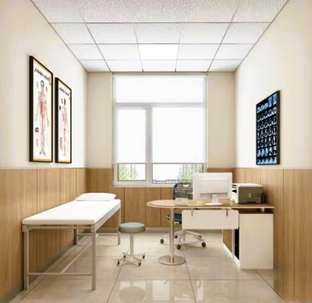 Medical examination room with desk and bed.