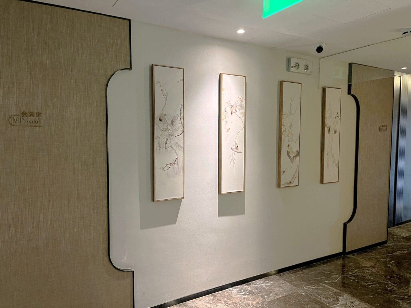 Hallway with framed minimalist art pieces.