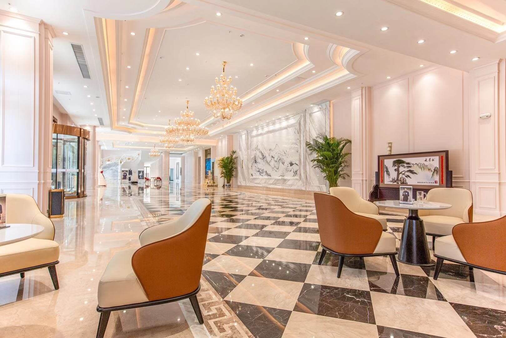 Luxurious hotel lobby with elegant chandeliers.